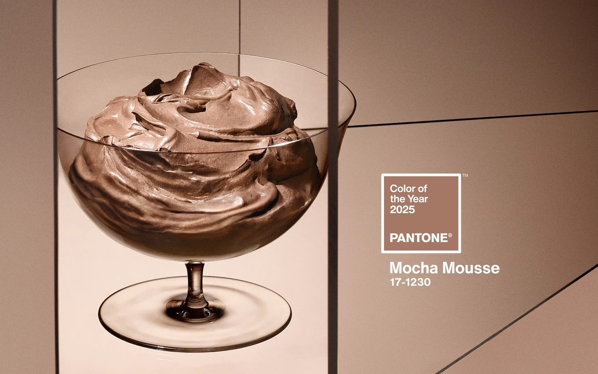 Glass bowl filled with rich mocha mousse next to Pantone Color of the Year 2025 label, Mocha Mousse 17-1230.