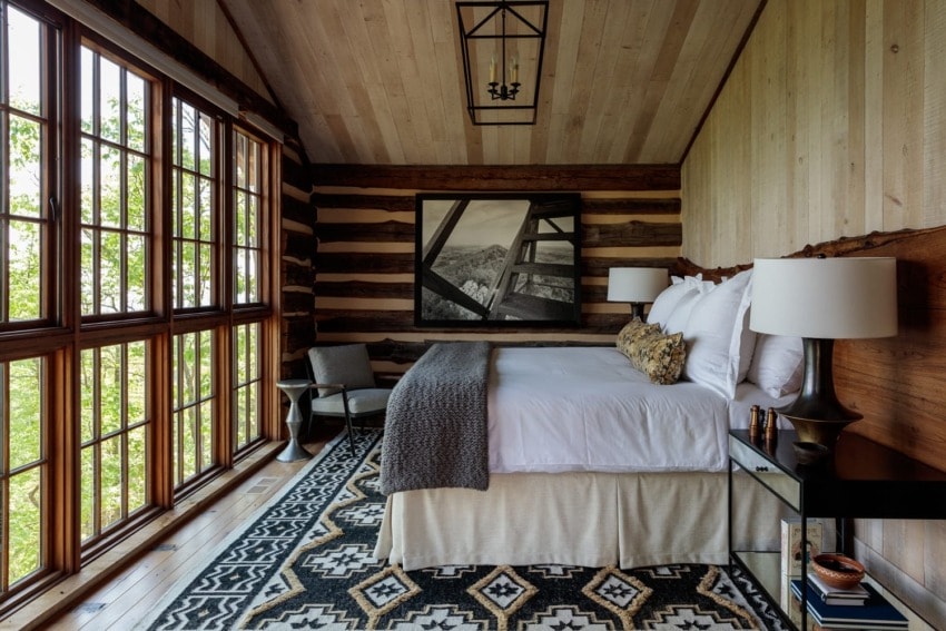 Interior of one of the Watchman Cabins at Blackberry Mountain with floor-to-ceiling windows.