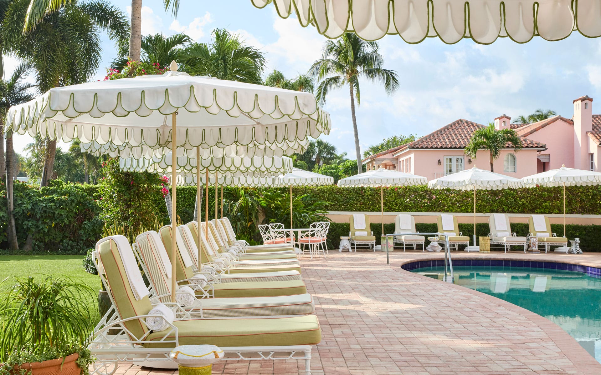 Umbrellas and lounge chairs at The Colony Hotel's pool.