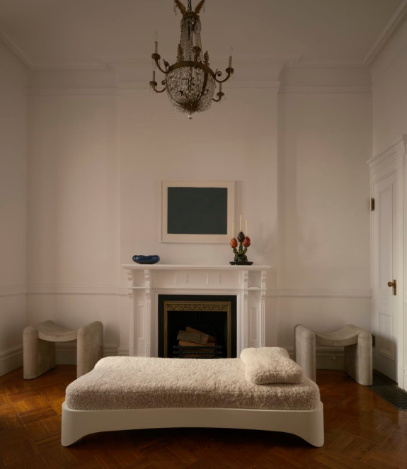 Concrete stools by Rick Owens sit near an aluminum Studio B.G. Robinson daybed.