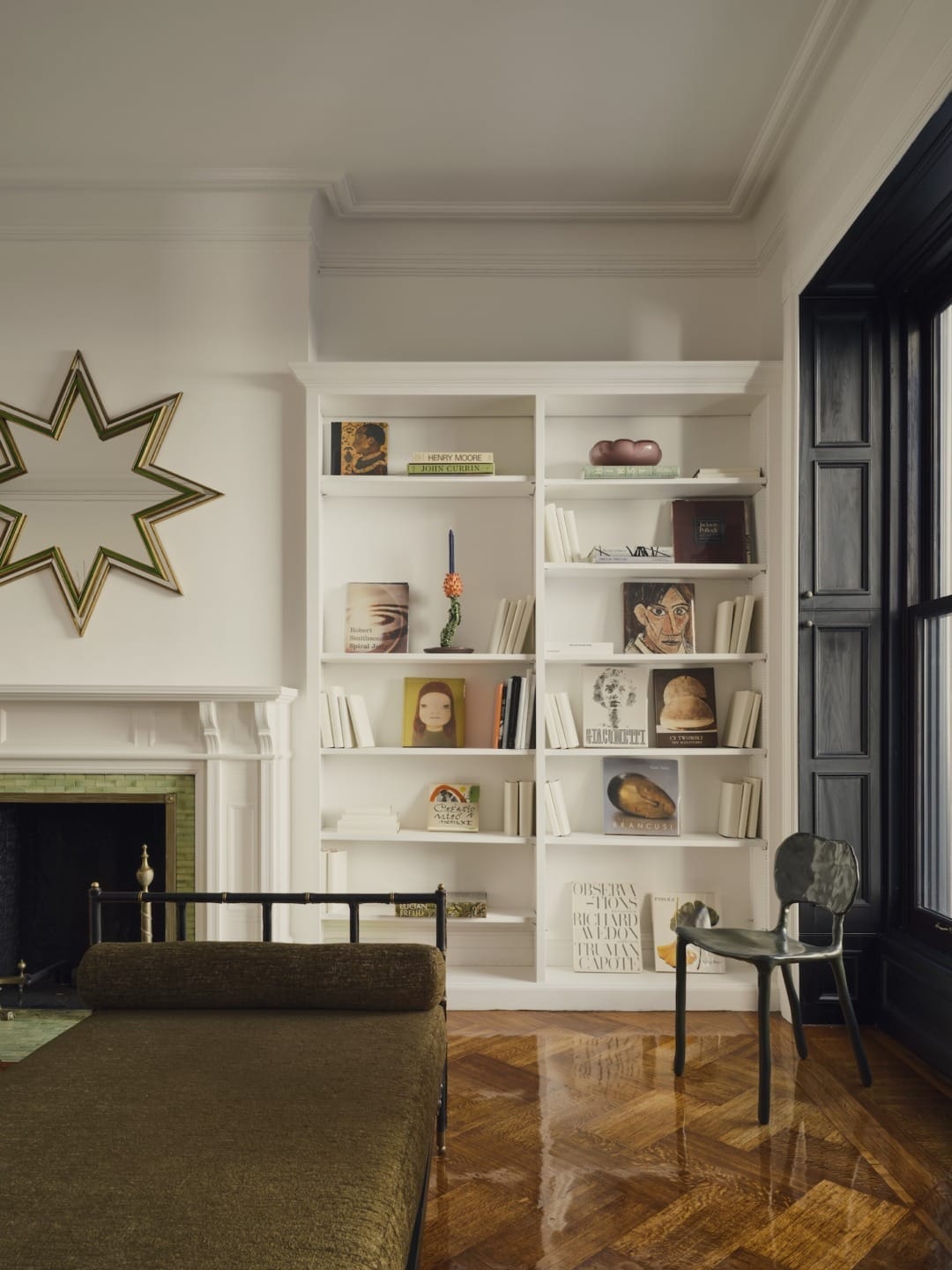 One of two beds by Jacques Adnet on the second floor.