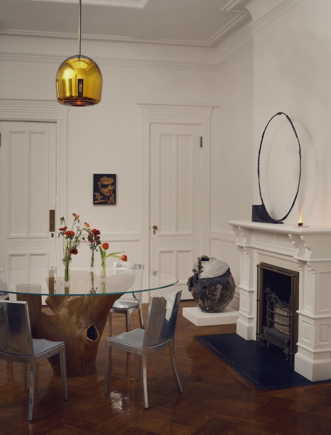 A table by Jose Zanina Caldas and pendant by Jeremy Maxwell Wintrebert in the dining room.
