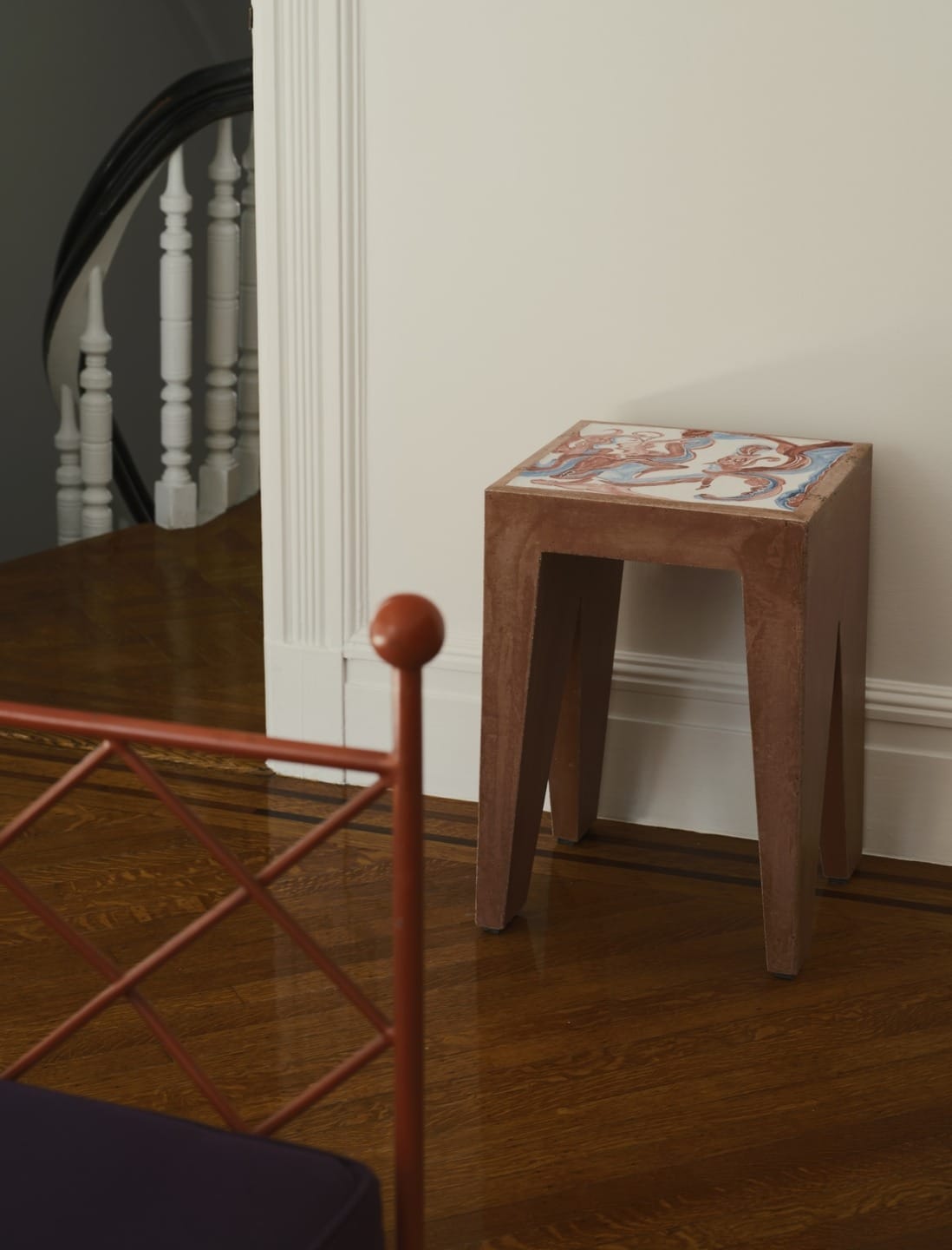 A hand-painted ceramic stool by Lola Montes.