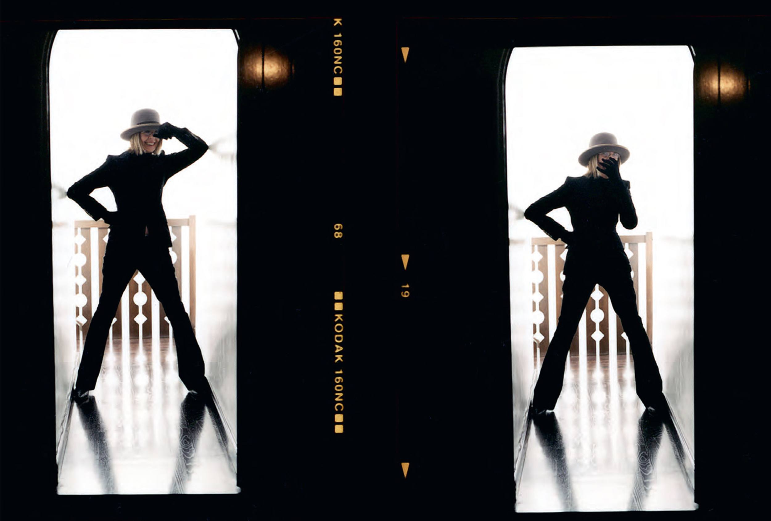 Silhouettes of a person in a hat and suit posing confidently in a doorway, with backlighting enhancing the dramatic effect.