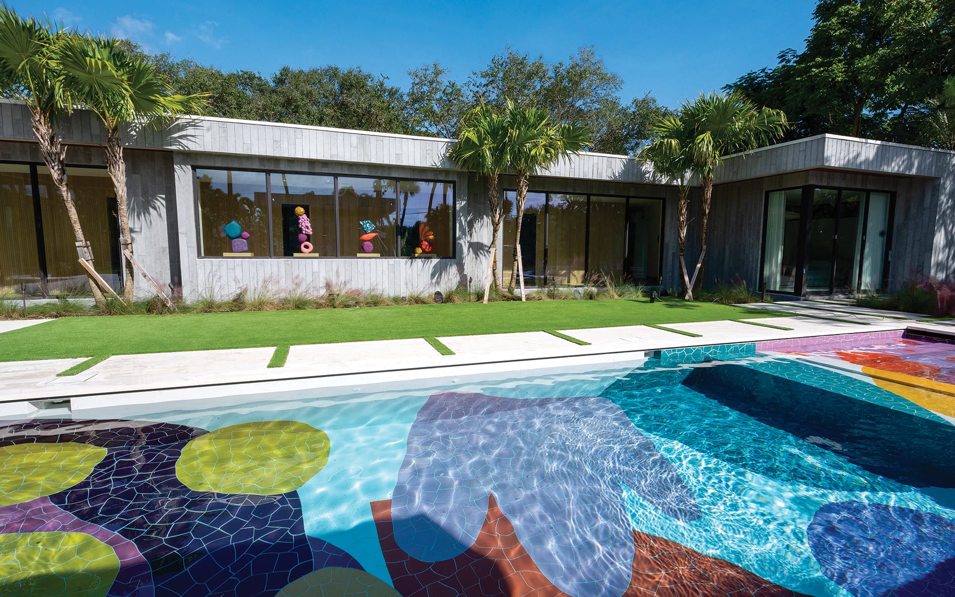A pool in Miami with ceramic tile work designed by Alex Proba.