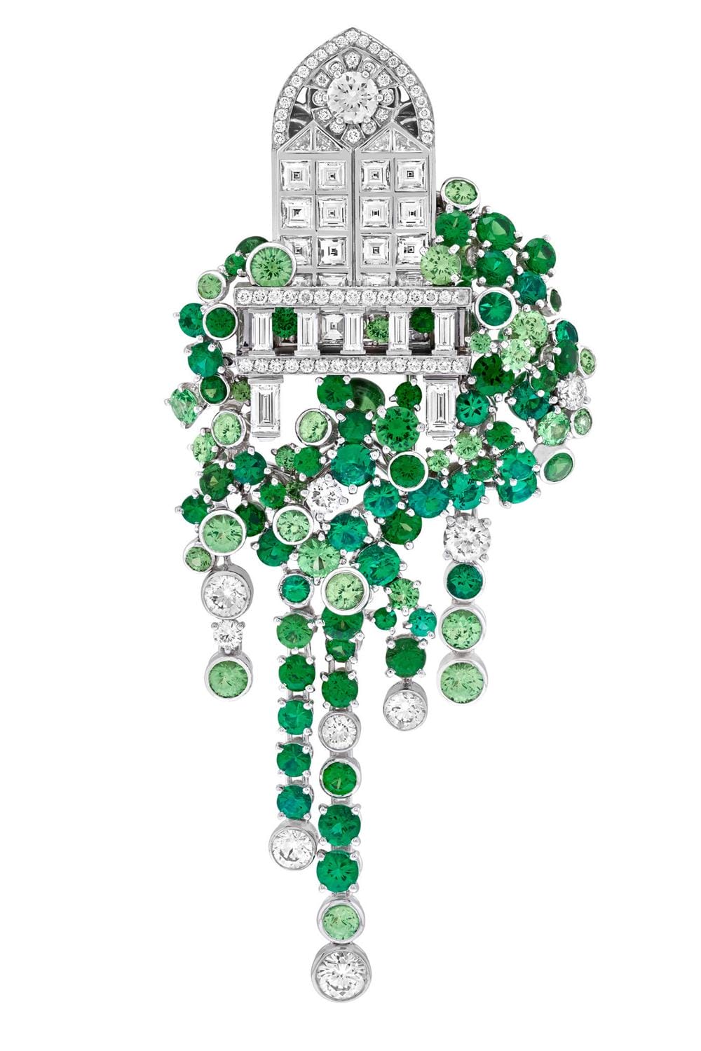 A jeweled brooch with intricate design, featuring green and clear gemstones in cascading patterns.