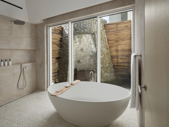 A deep soaker tub in one of the baths inside the new Spice of Life villa at Sugar Beach.