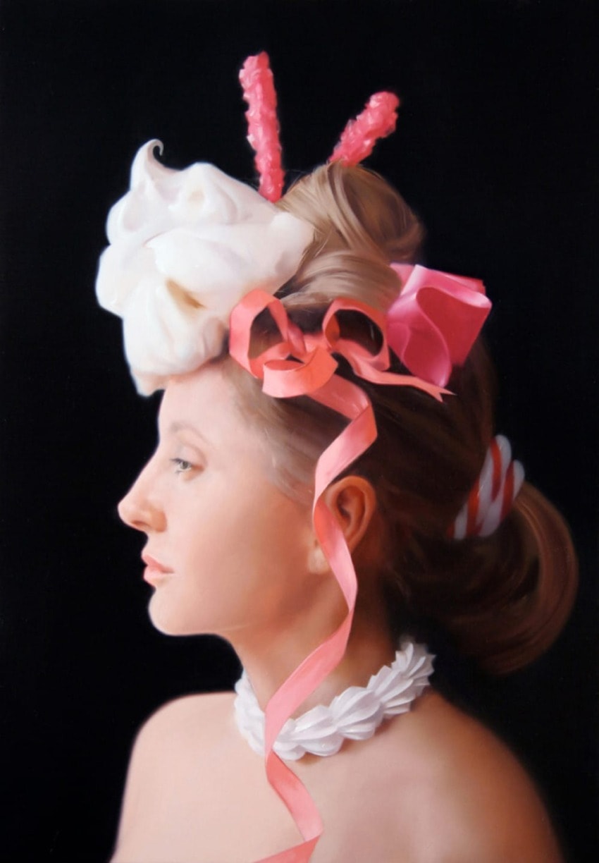 Woman with elaborate candy-themed hairpiece and decorative ribbons against a black background, in profile view.