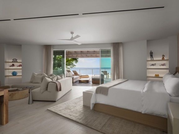 One of the nine bedrooms inside the new Spice of Life villa at Sugar Beach, a Viceroy Hotel, in St. Lucia, displays works by Invader, MSCHF, Andre Saraiva, Julian Opie, and Florentijn Hoffman.