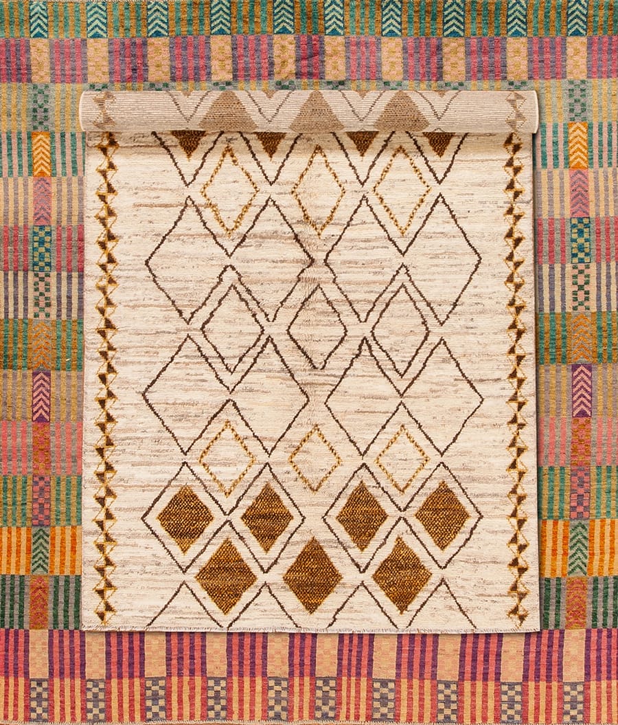 Colorful patterned textile with geometric diamond designs and intricate border details.