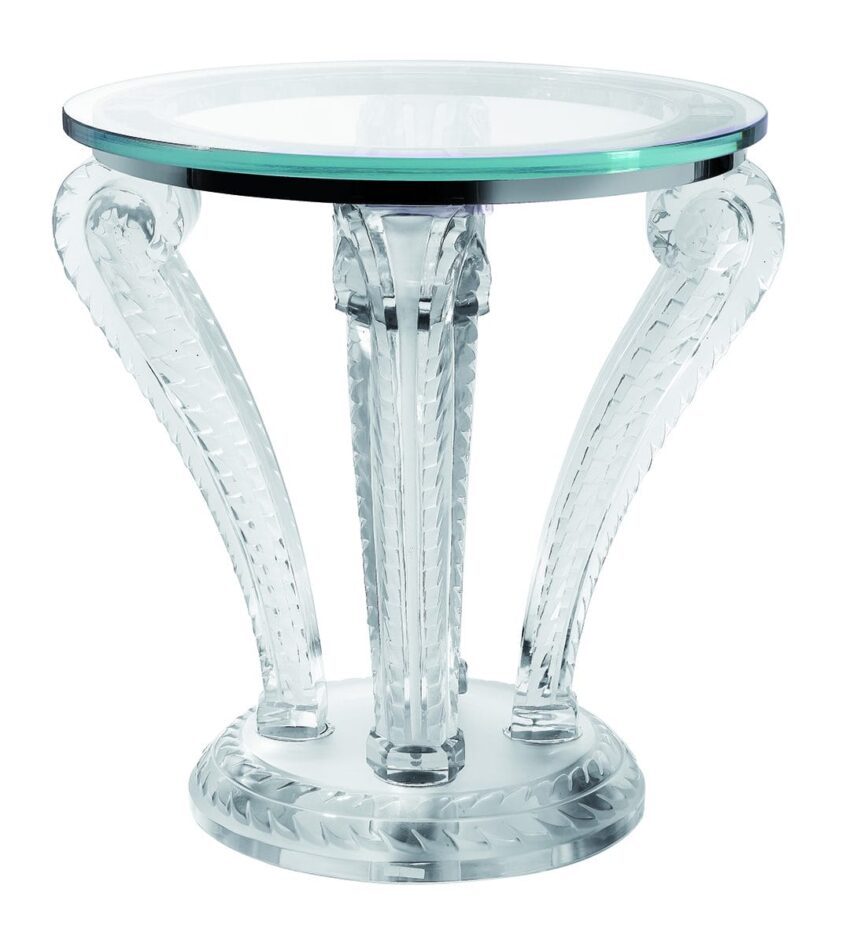 Elegant glass side table with intricate etched legs and round top.