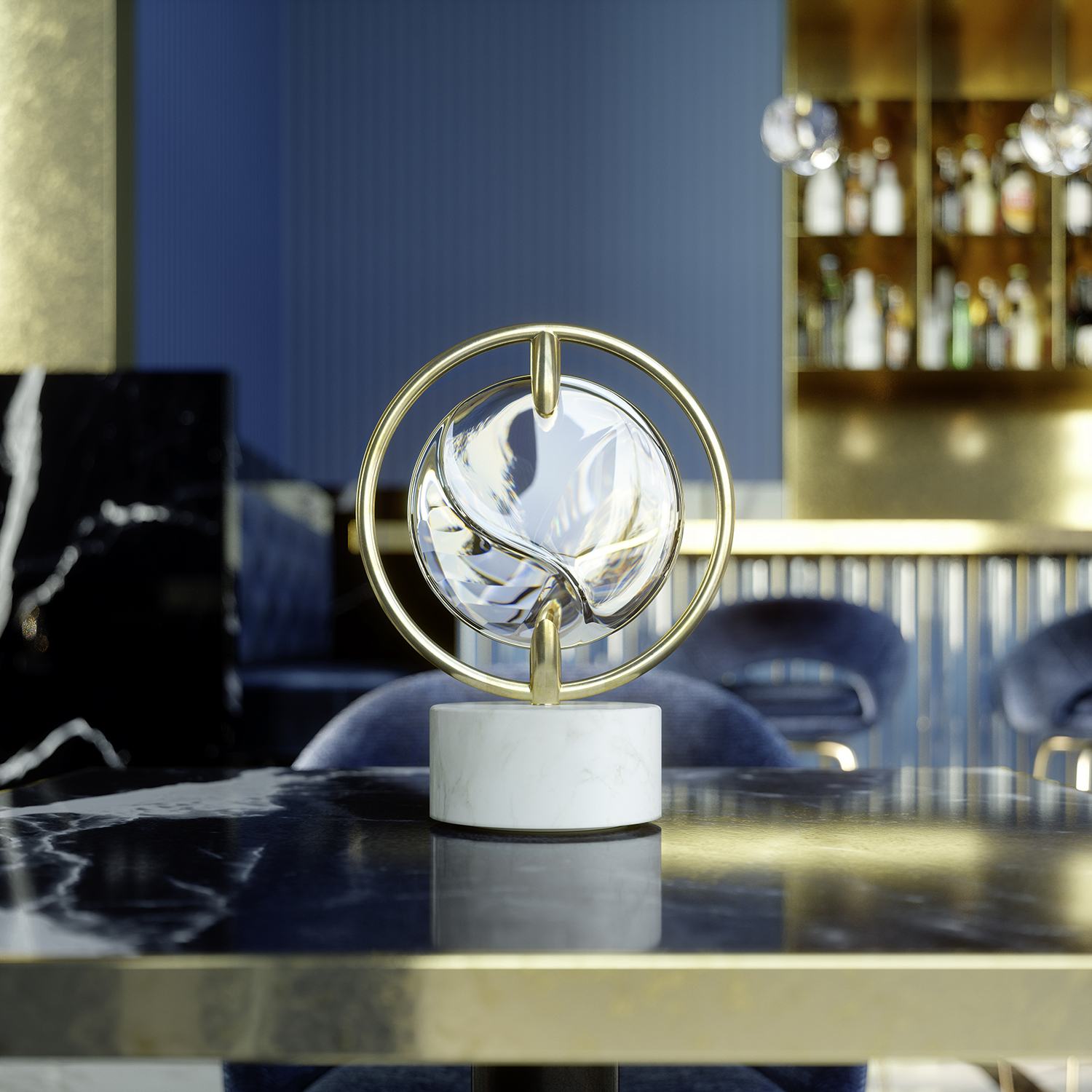 Modern abstract sculpture with gold rings and a glass sphere on a marble base, set on a dining table in a stylish room.