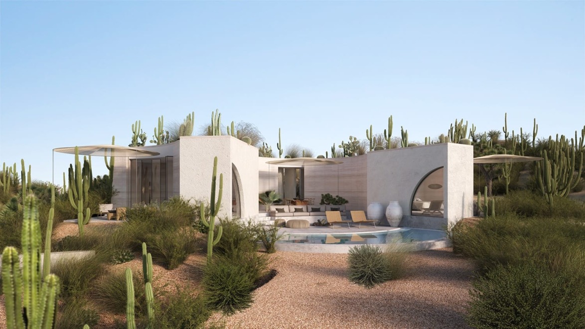 Modern desert house with circular pool, surrounded by cacti and lush vegetation under a clear blue sky.