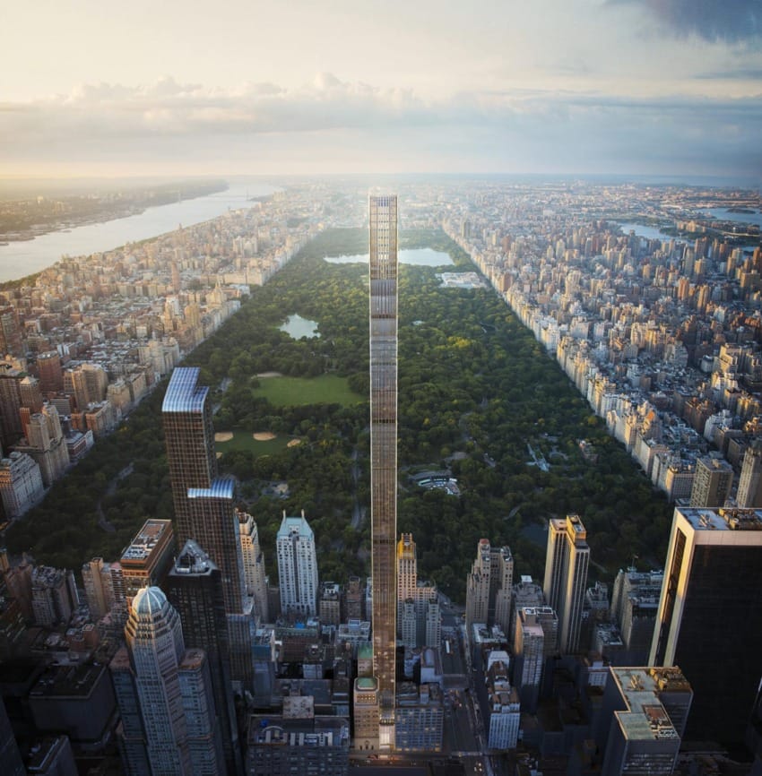 Aerial view of Central Park and surrounding skyscrapers at sunset, highlighting the slender, tall building in the center.