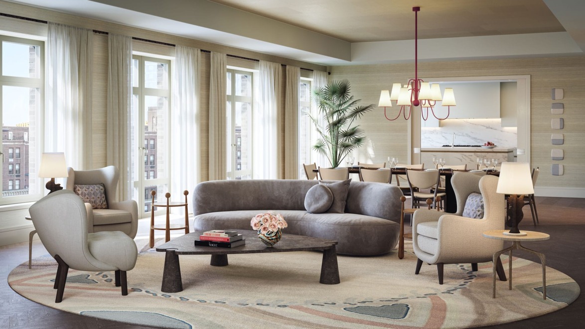 Modern living room with elegant furniture, large windows, round rug, and cozy seating area with soft lighting.