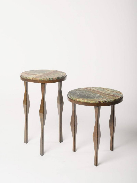 Two wooden stools with colorful marble tops on a light background.