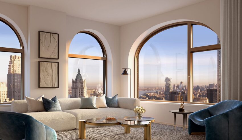Modern living room with large arched windows, comfortable seating, stylish decor, and a view of the city skyline.