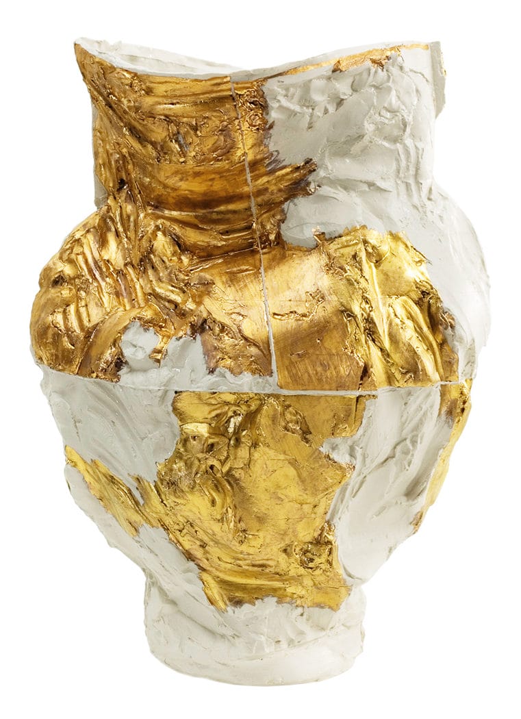 Ceramic vase with textured white and gold surfaces, featuring an abstract, artistic design.