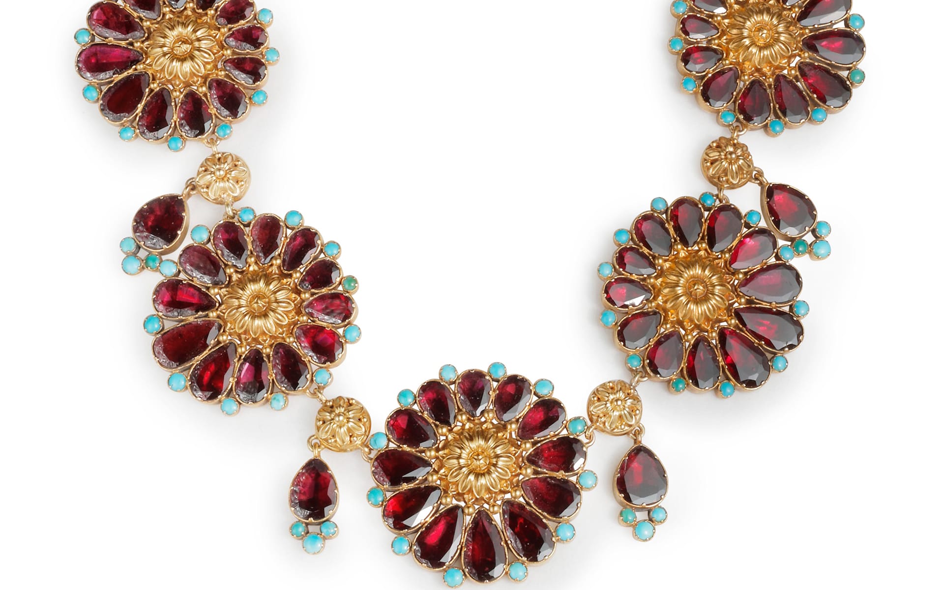 Gold floral necklace with red and turquoise gemstones arranged in an ornate, symmetrical design.
