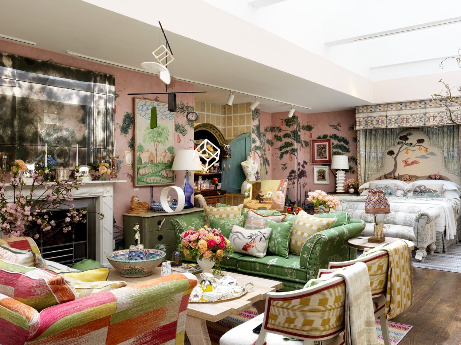 Colorful, eclectic living room with floral patterns, various textures, and decorative art pieces.