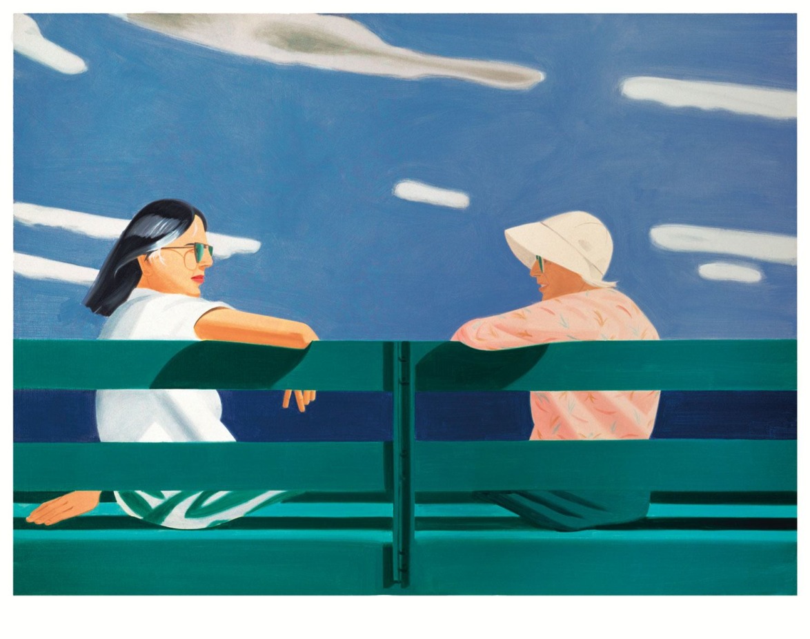 Two people sitting on a green bench under a blue sky with clouds, engaged in conversation.