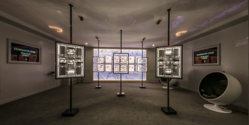 Modern exhibition room with freestanding light panels and information displays on walls, showcasing historical content.