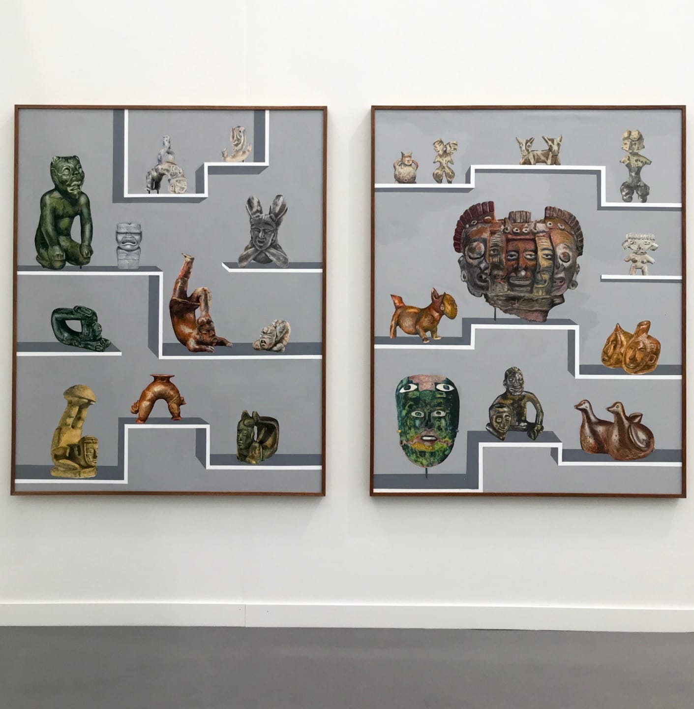 Two framed artworks featuring various colorful ceramic sculptures displayed on a gray background in a gallery setting.