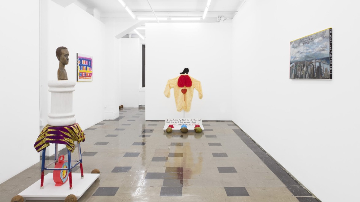 Modern art gallery with sculptures and paintings on walls, featuring a mix of vibrant colors and diverse textures.