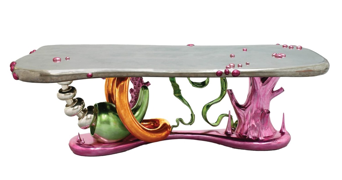 Colorful modern art table with abstract shapes, featuring vibrant pink, green, orange, and silver elements.