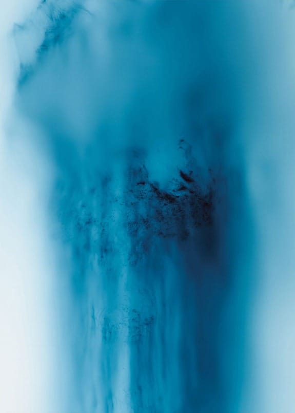 Abstract blue and black fluid art with a soft gradient effect and swirling patterns, creating a mysterious and calming ambiance