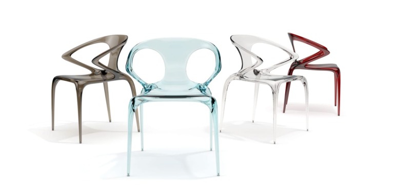 Transparent modern chairs in various colors arranged on a white background.