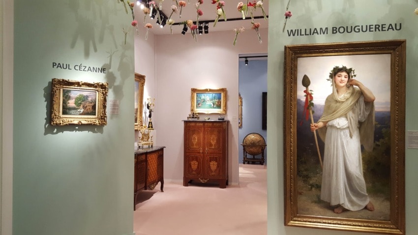 Art gallery interior with paintings by Paul Cézanne and William Bouguereau, a cabinet, and decorative items.