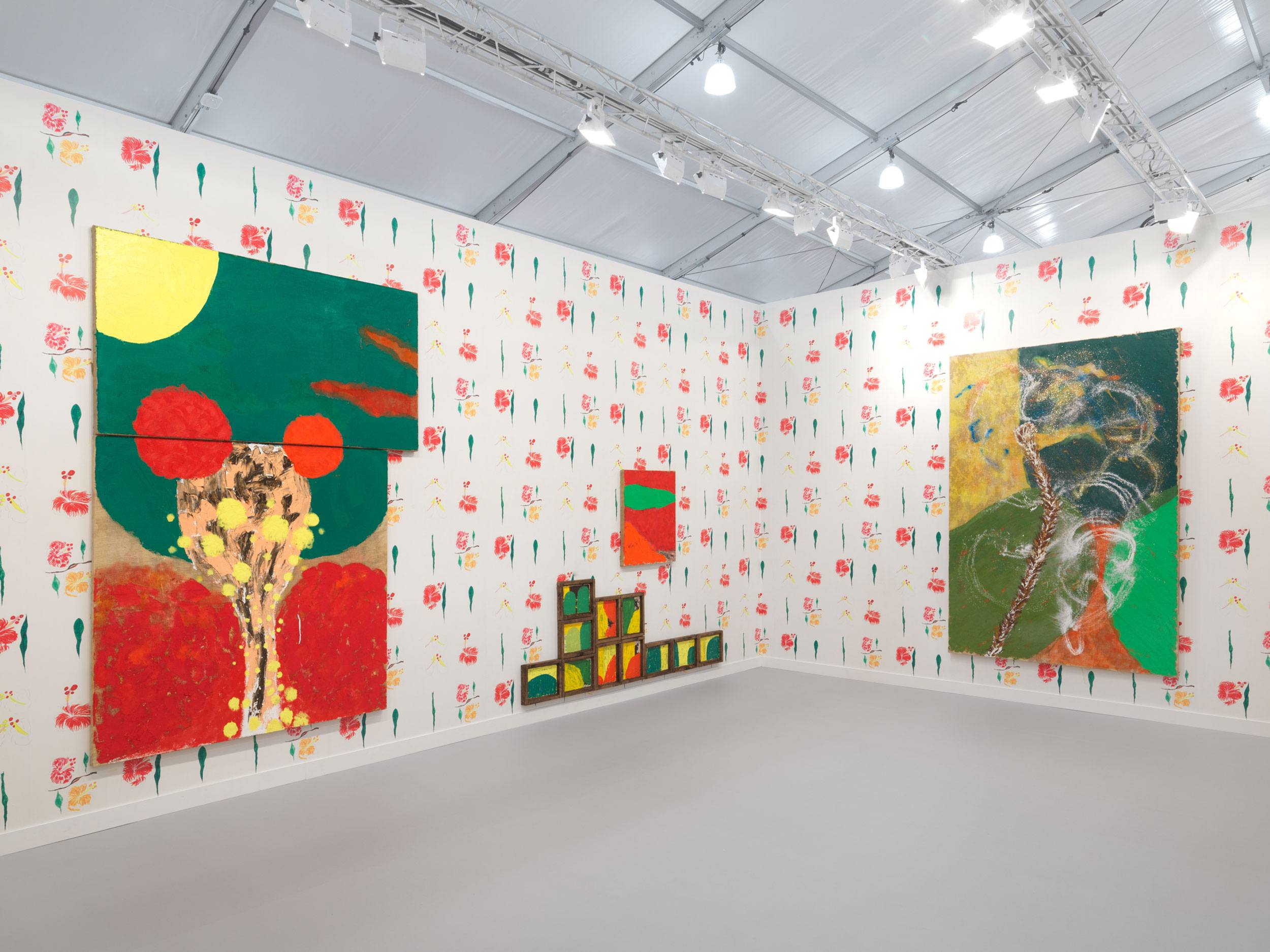 Art gallery with colorful abstract paintings on walls, vibrant patterns, and contemporary design in a spacious exhibition hall.