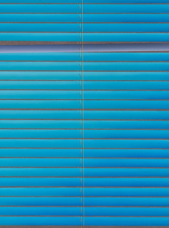 Blue horizontal window blinds with sunlight highlighting the edges, creating a pattern of lines and shadows.
