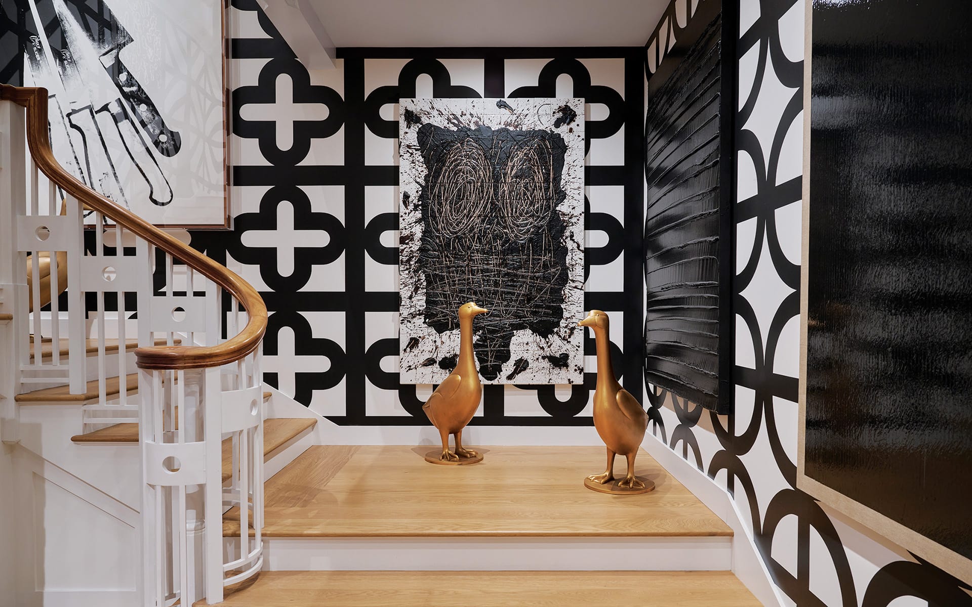 Peter Marino has a pair of François-Xavier Lalanne perched in front of an artwork by Rashid Johnson
