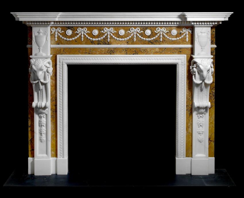 Ornate decorative fireplace mantle with classical white columns and intricate embellishments on a golden background.