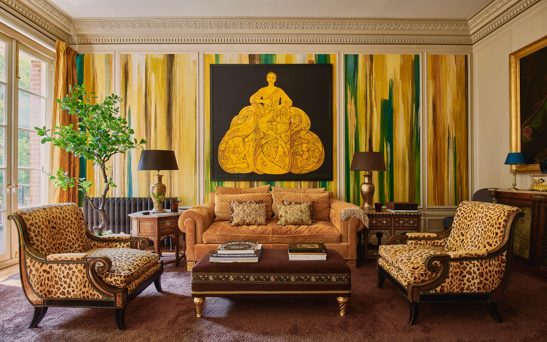 Luxurious living room with patterned chairs, large artwork, vibrant green and yellow walls, and decorative lamps.