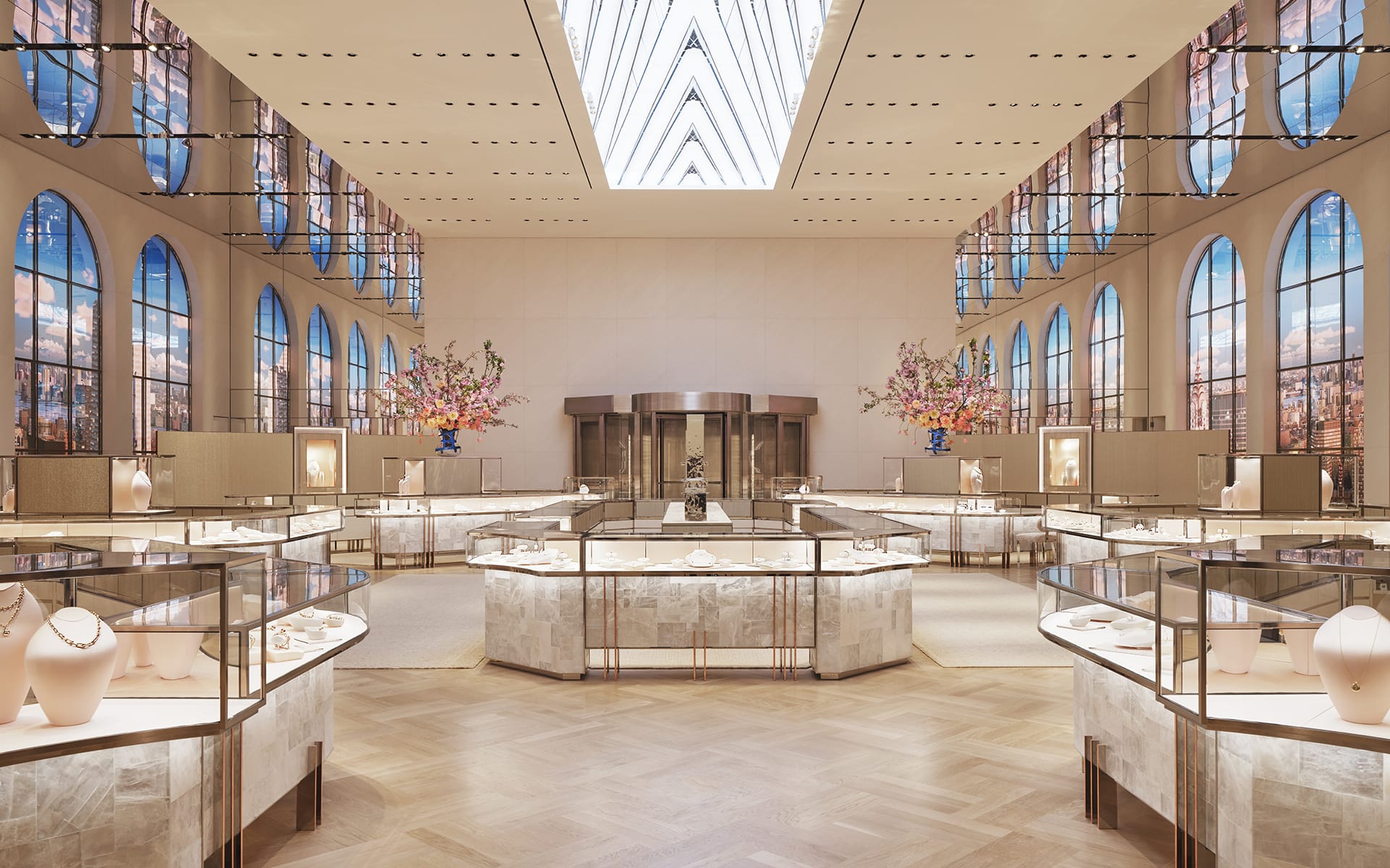 Luxurious jewelry store interior with elegant display cases, high ceilings, and large arch windows.