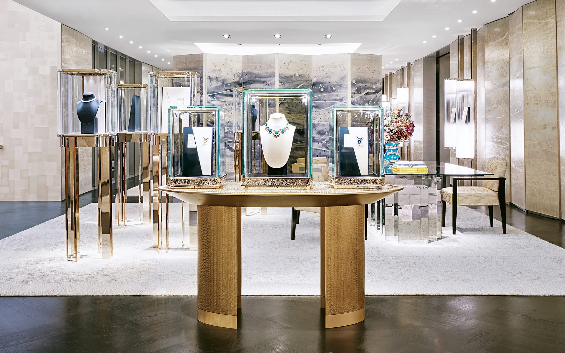 Luxury jewelry store interior with elegant display cases, necklaces, and modern decor.
