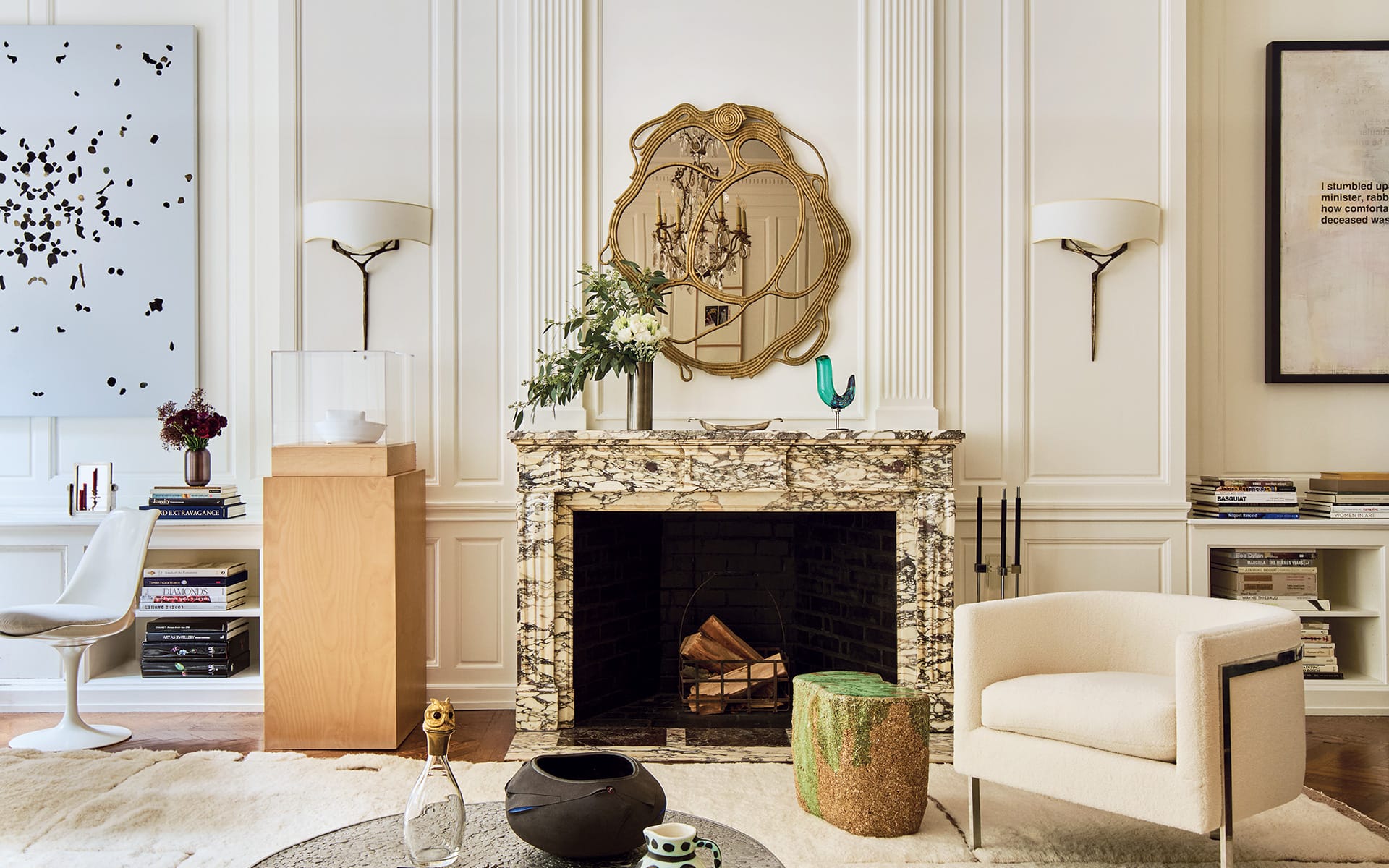 In the salon, a Campana Brothers mirror from Friedman Benda hangs above a marble fireplace.