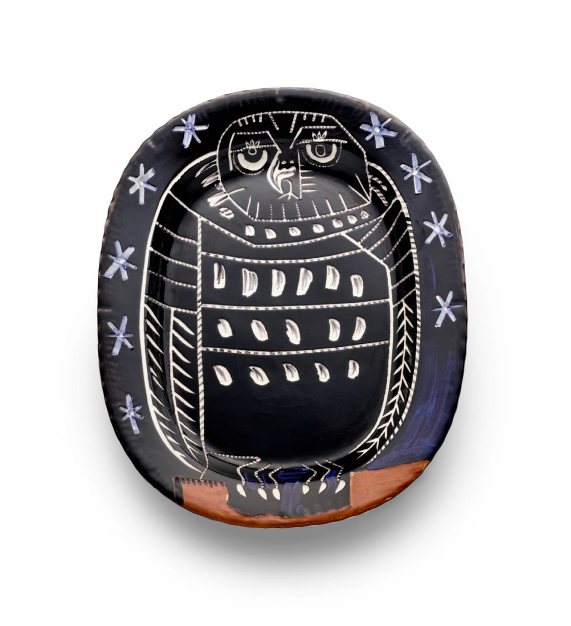 Ceramic plate with abstract owl design in black, white, and brown, featuring star patterns around the edge.