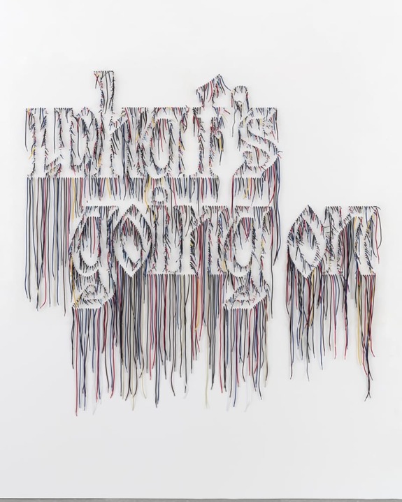 Text art made of colorful strings spelling out "what's going on" on a white background.
