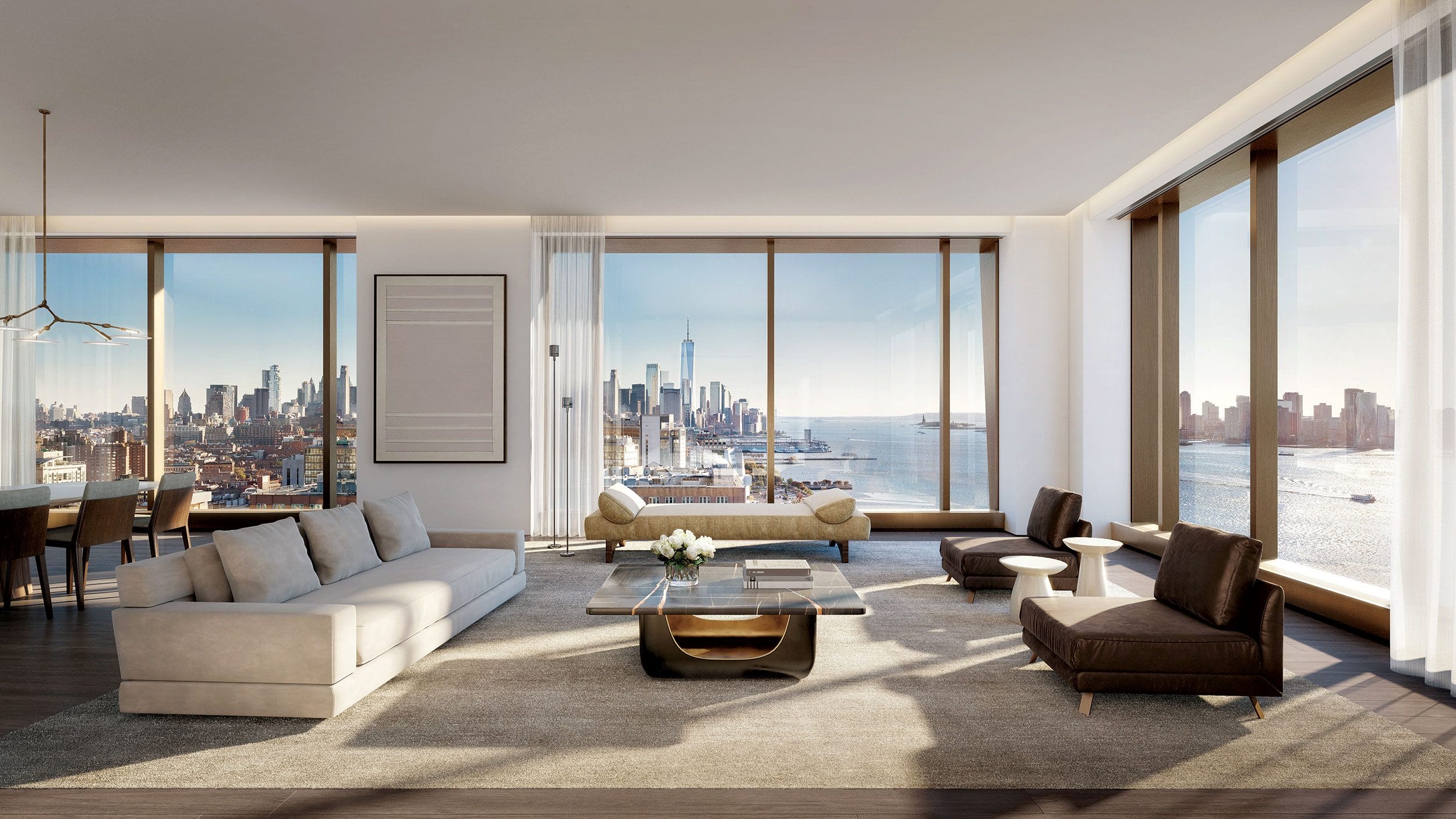 Modern living room with large windows offering a panoramic view of a city skyline and river, furnished with elegant sofas.