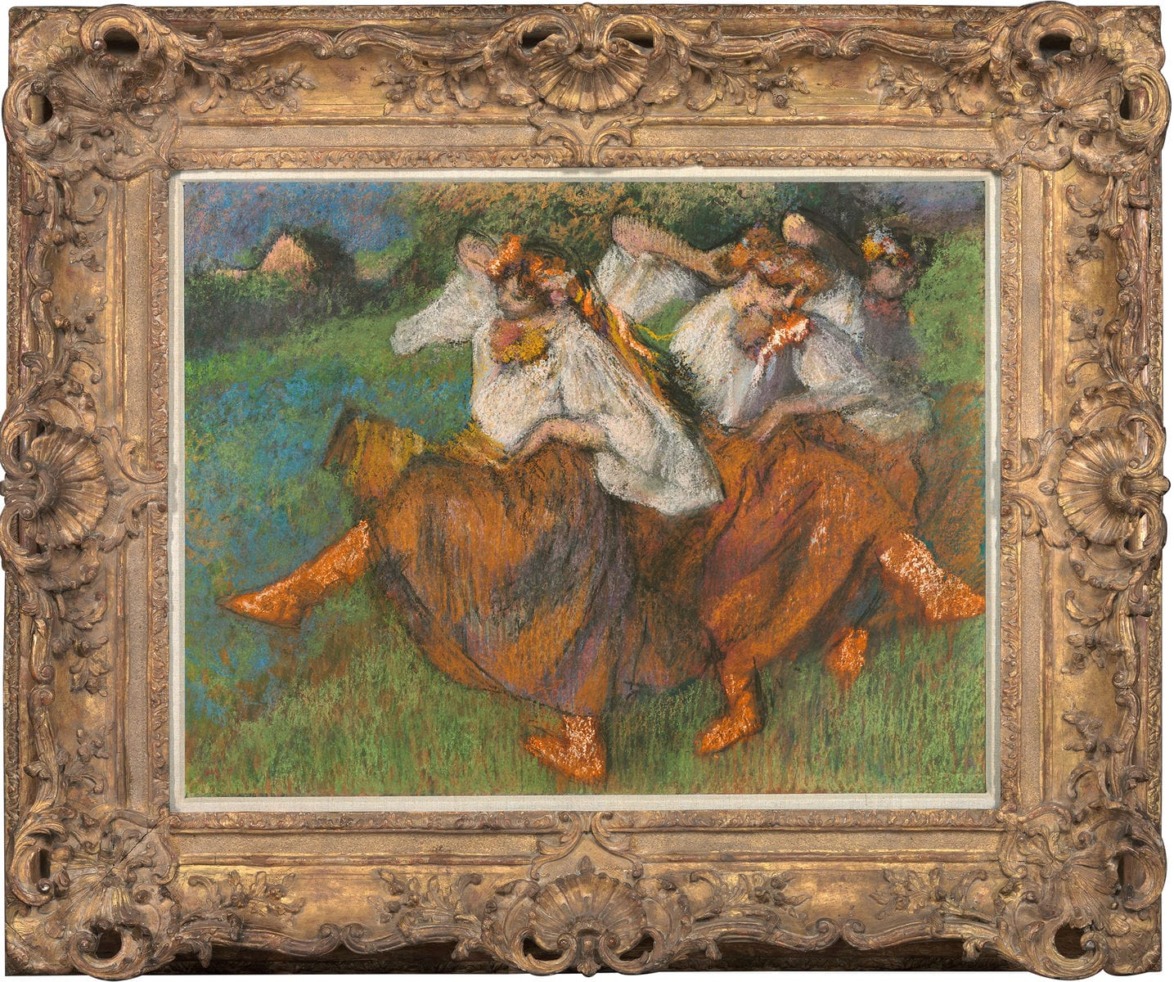 Painting of four women dancing in colorful dresses and traditional attire, set in a lush green landscape with ornate frame.