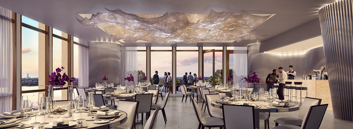 Elegant restaurant interior with modern lighting, large windows, set tables, and people at the bar.