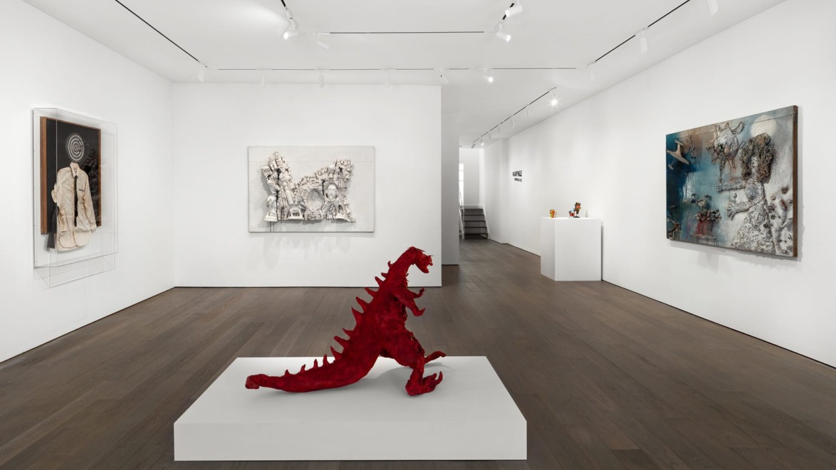 Contemporary art gallery with a red dinosaur sculpture on a white pedestal and abstract paintings on white walls.