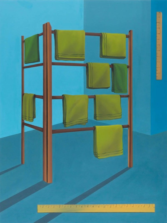 Wooden towel rack with green towels, casting shadows on a blue floor, surrounded by yellow measuring sticks.