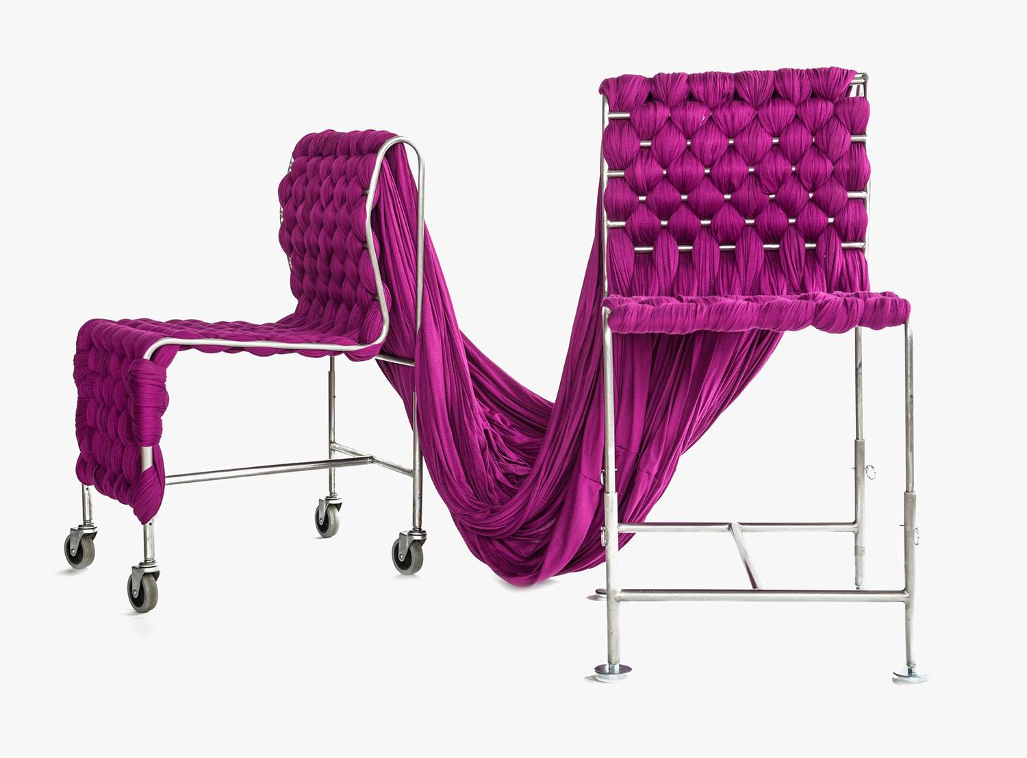 Two modern chairs with woven magenta fabric and metal frames connected by a draped fabric piece.