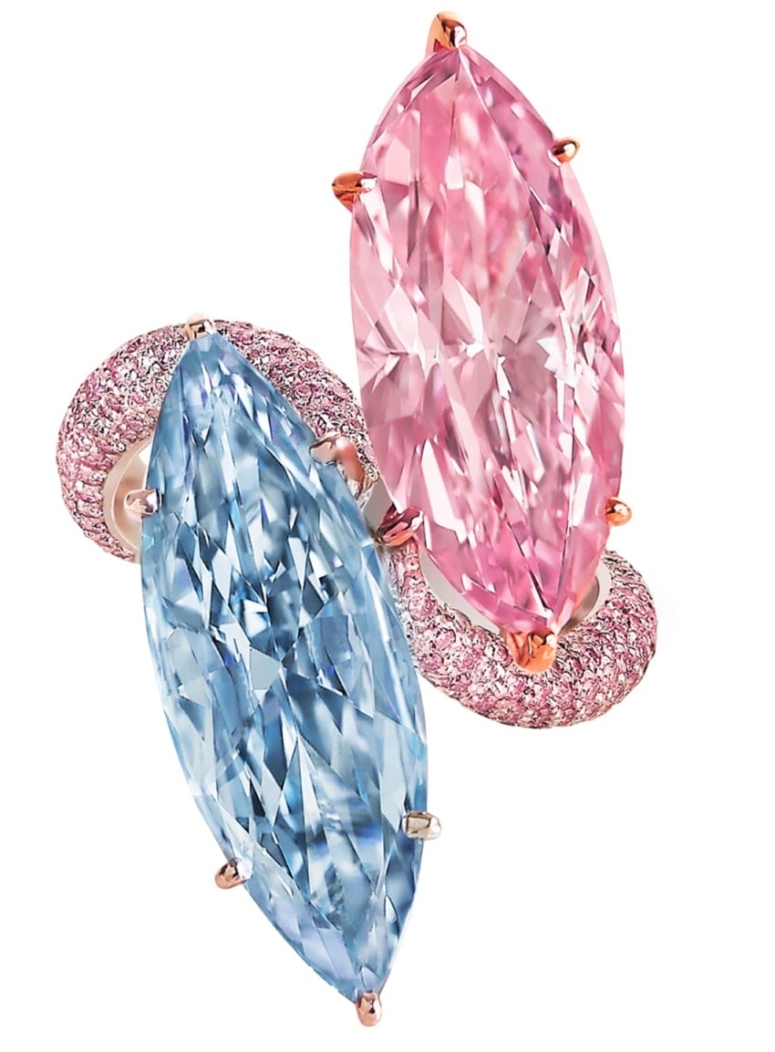 Pink and blue marquise-cut gemstones set in a decorative ring design with sparkling accents.