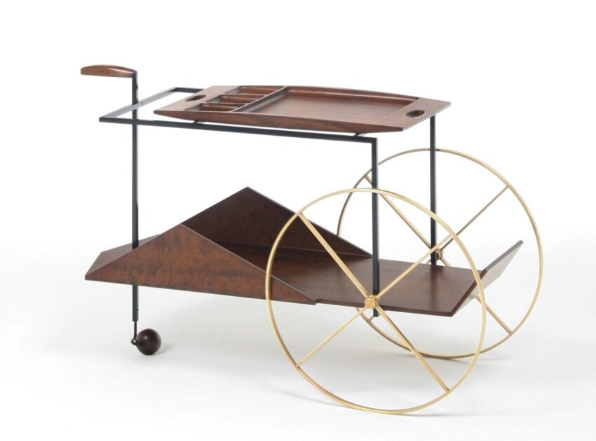 Mid-century modern bar cart with wooden trays, metal frame, and large brass wheels, designed for serving drinks.